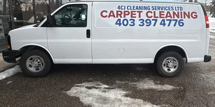 The white 4CJ Cleaning Services van, lettered Carpet Cleaning with the phone number on its side